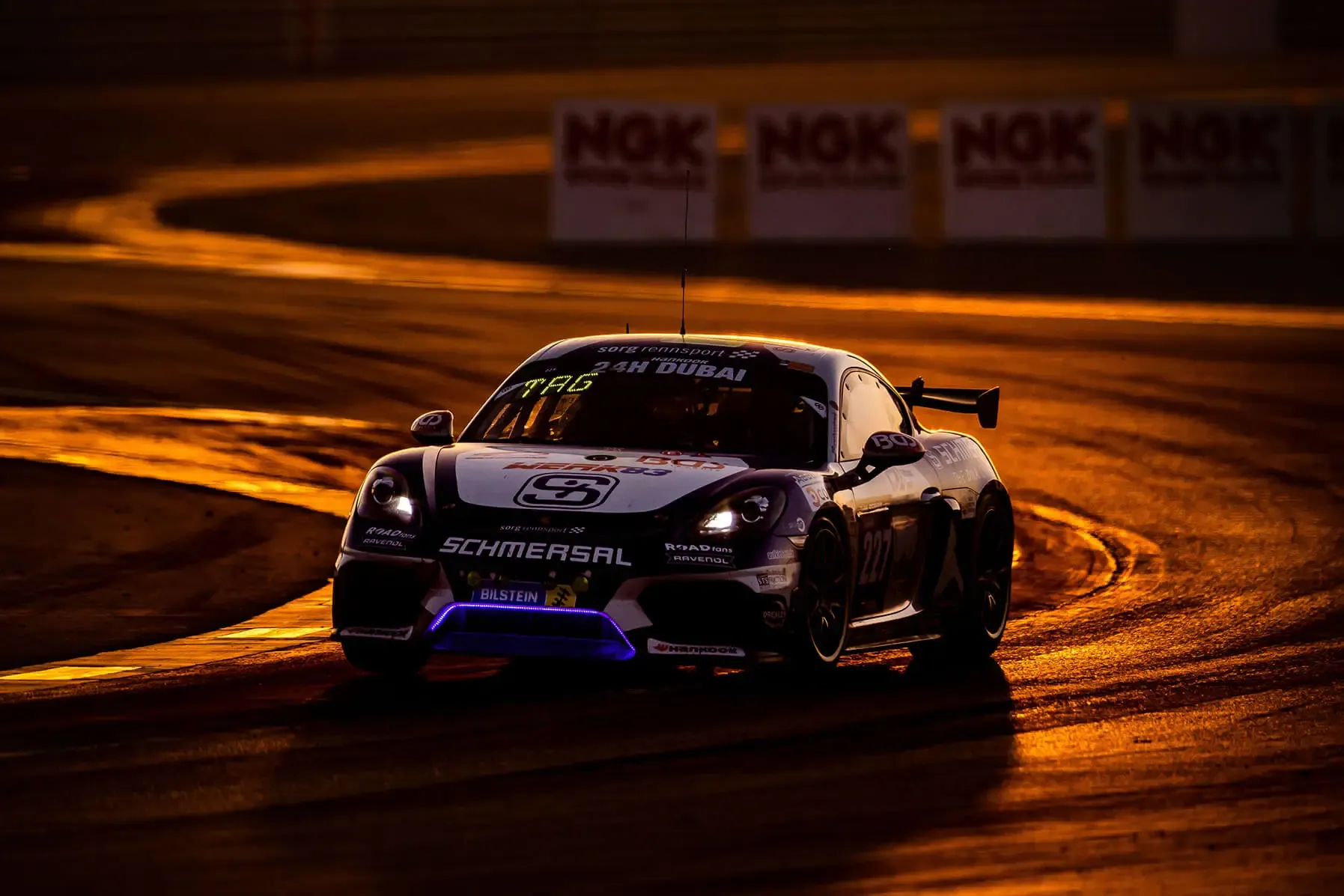 Daniel in a Porsche GT4 at the 24h Dubai at sunset